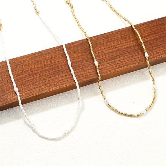 ELARA | MEHRREIHIGES HALSKETTEN-SET MIT GOLD UND PERLEN