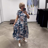 EVANGELINE | MAXIKLEID MIT FLORALEM STUFENROCK