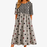 AMELIA | MODERNES CHARM-MIDIKLEID MIT MUSTERMIX UND TASCHEN