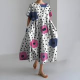 MEERI | KÜNSTLERISCHES MAXIKLEID MIT VINTAGE-BLUMENMUSTER UND UNBEKÜMMERTER ELEGANZ