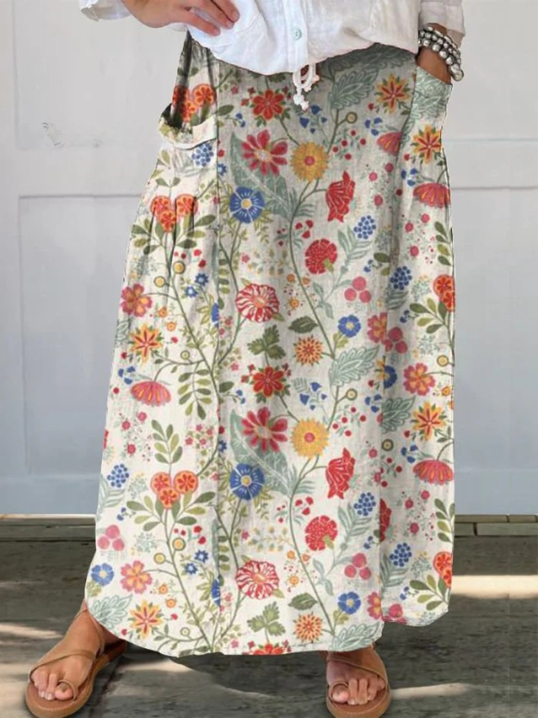 FABI | ROCK MIT BLUMENPRINT UND ELASTISCHEM BUND MIT TASCHEN