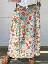 FABI | ROCK MIT BLUMENPRINT UND ELASTISCHEM BUND MIT TASCHEN